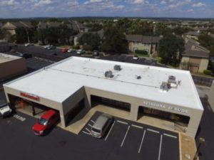 aerial view of a commercial building with a flat roof