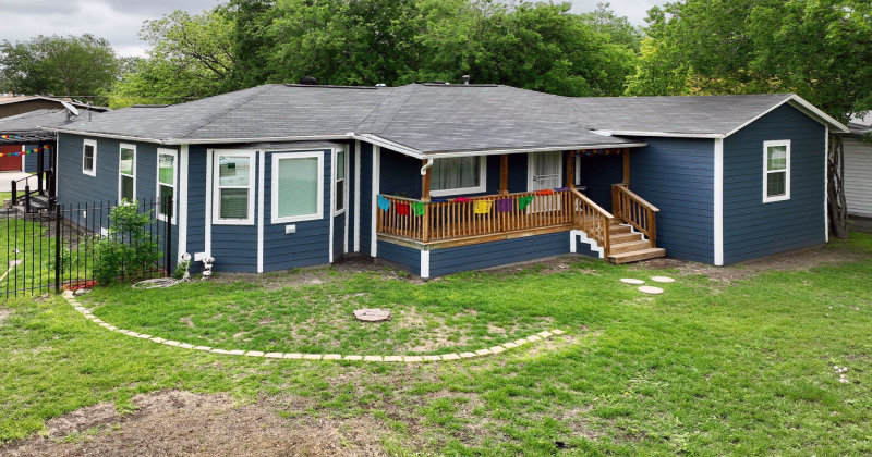 House with newly installed blue siding